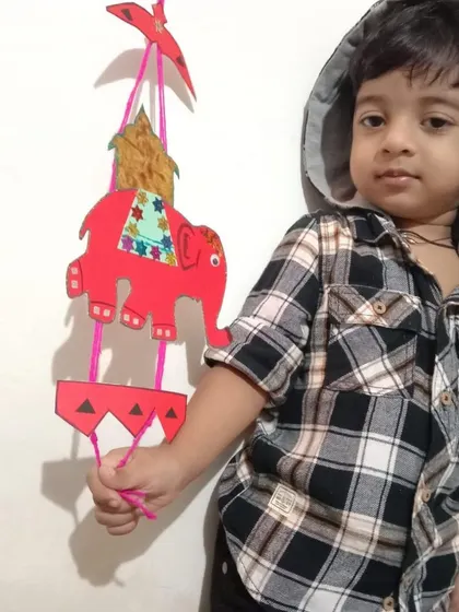 Children proudly display their artwork for Dusshera. Creating these festive crafts helps them connect with cultural traditions while practicing important skills like cutting, pasting, and designing.
