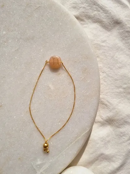Another view of my initial embossed Peach Moonstone bracelet.