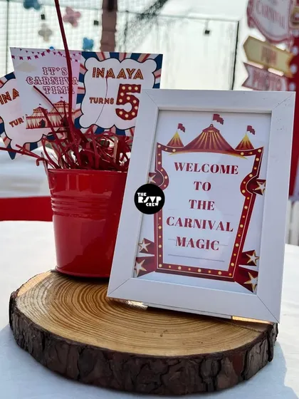 'Welcome to the Carnival Magic'. A themed centerpiece with custom carnival tickets.