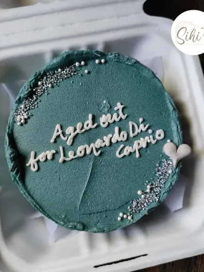 A birthday cake with a topical joke for a fan. This design, which reads "Aged out for Leonardo DiCaprio," is a great example of how we can incorporate pop culture humor into your cake.