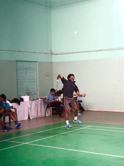 A player preparing to hit a smash, demonstrating readiness and perfect positioning.