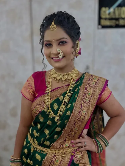 A smiling portrait of the model, showcasing the complete Maharashtrian bridal look created for a student demonstration.
