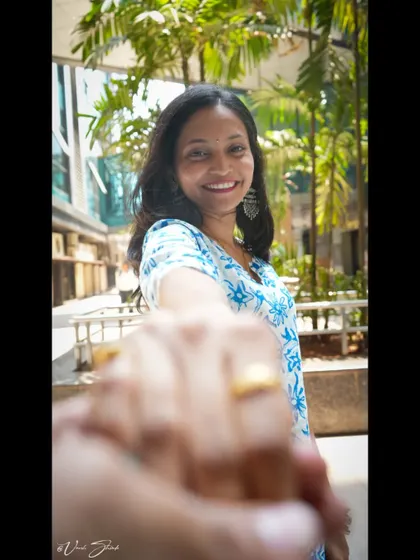 This "follow me to" style shot is playful and engaging. It's a great way to create a connection with the viewer and add a fun, interactive element to a portrait session.