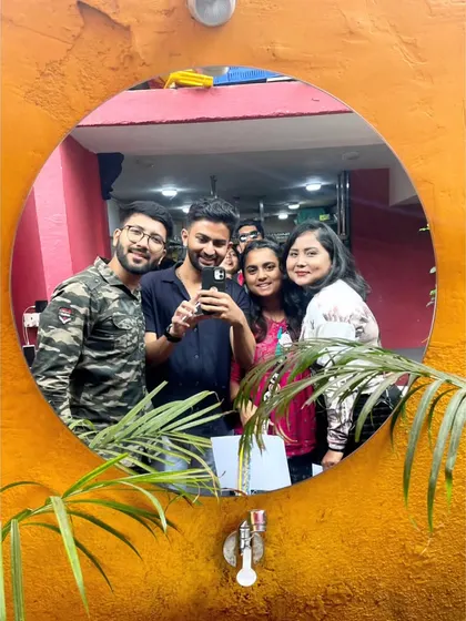A mirror selfie with the group. A creative way to capture the moment.