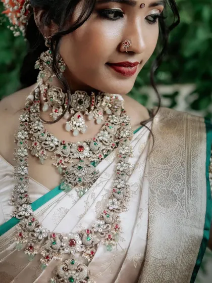 A detailed shot of the intricate floral and peacock motifs in this Victorian choker and haram set. This rental jewellery piece is a work of art, perfect for making a statement.