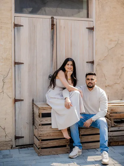 A relaxed and stylish pre-wedding portrait. Using rustic textures like these wooden crates and doors adds character to the photos. It’s about finding beauty in unexpected places and making it part of your story.
