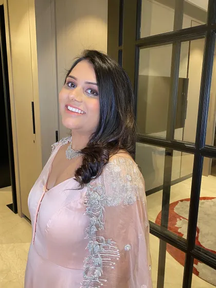 This shot captures her beautiful smile and the soft, glowing makeup. It’s a look that feels special without being over the top.