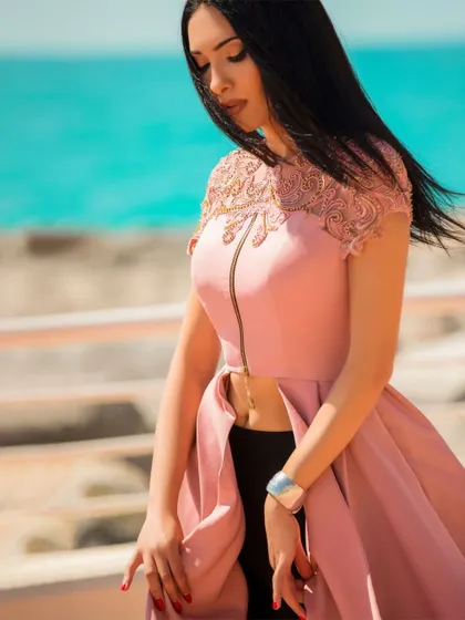 A close-up version of the beachside look, focusing on the lace detail of the top and the model's expression. This provides a more intimate view within the series.