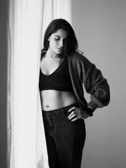 Another shot from the same series, showing a different pose. The monochrome treatment enhances the feeling of drama and intimacy.