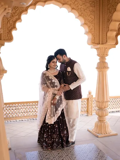 A beautiful pre wedding shot of a couple in a traditional setting, showcasing a timeless and elegant look.