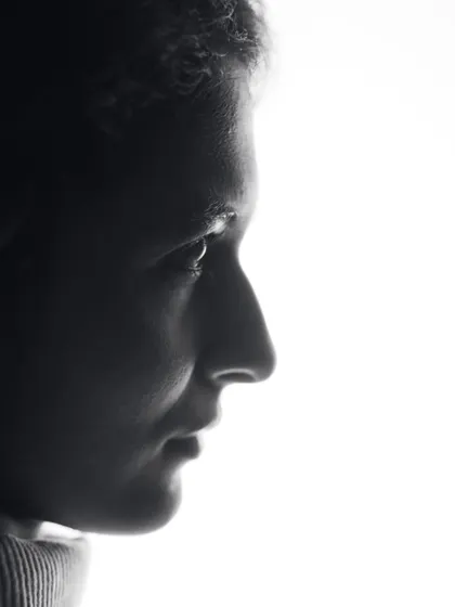 A delicate profile shot in high-contrast black and white. This image highlights my features in a soft, artistic light, perfect for minimalist and intimate portraiture.