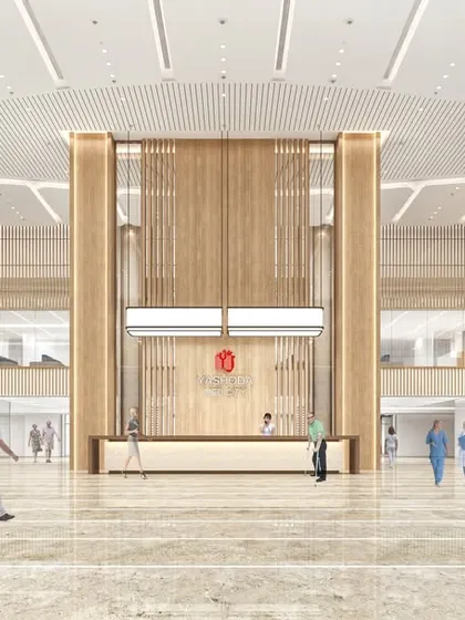 Another view of the main lobby at Yashoda Medicity, envisioned as a next-generation healthcare facility. The design integrates a unit aggregate model, ensuring a seamless continuum of care under one roof.