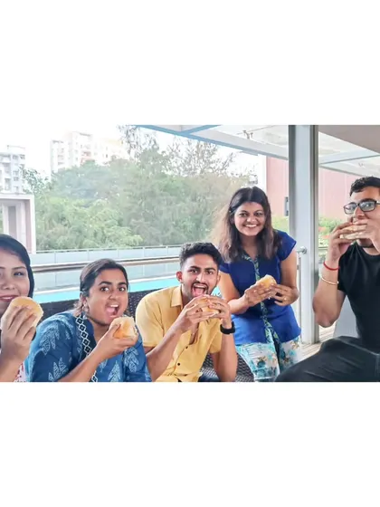 The whole group enjoying some vada pav. Food tours are a big part of our city explorations.