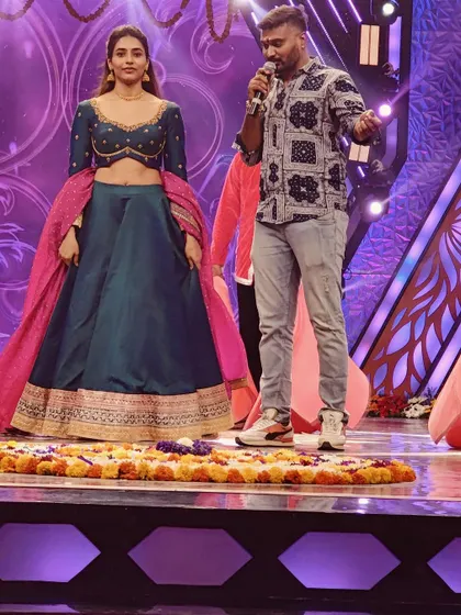 Instructing on the mic during a rehearsal for the Star Suvarna 'Ugadi Utsava' show.