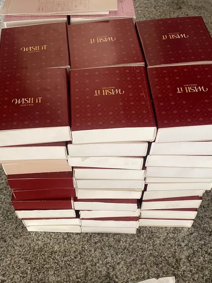 Stacks of our signature red Wishit boxes, waiting to be filled with Diwali goodies. This is what gratitude and a little bit of chaos looks like.
