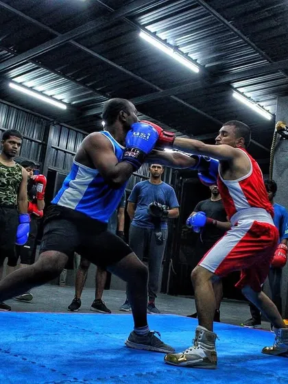Footwork and positioning on full display. A fighter lands a clean jab while maintaining distance during a competitive sparring round.