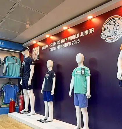 The official merchandise and apparel sales booth at the BWF World Junior Championships. We design and construct these retail structures as part of our venue transformation services.