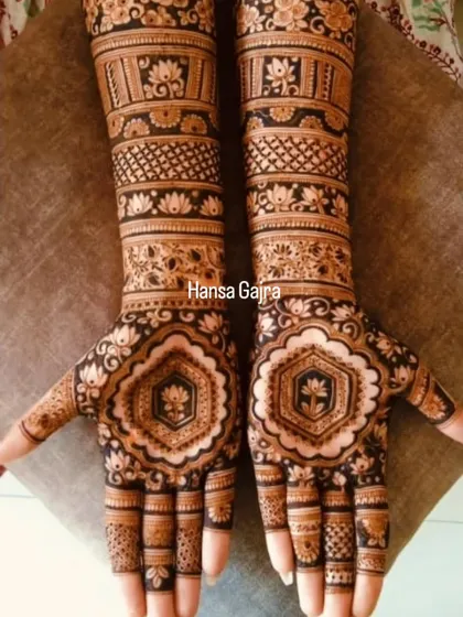 A beautiful blend of geometric and floral patterns. The central hexagonal lotus motif on the palm is surrounded by intricate bands of traditional designs, creating a rich and layered look.
