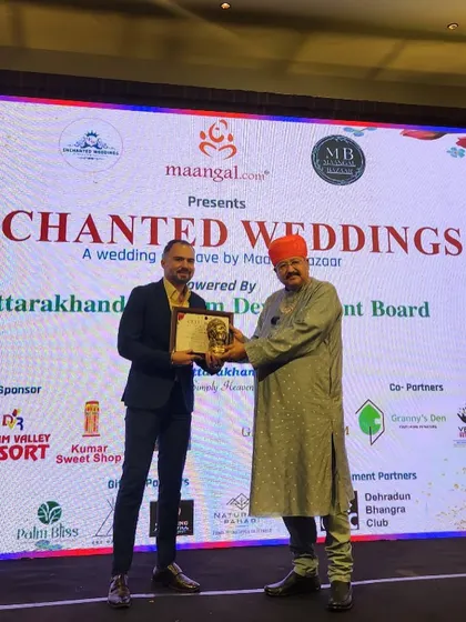 Receiving an award at the 'Enchanted Weddings' conclave. It's an honor to be recognized for my contribution to the industry.