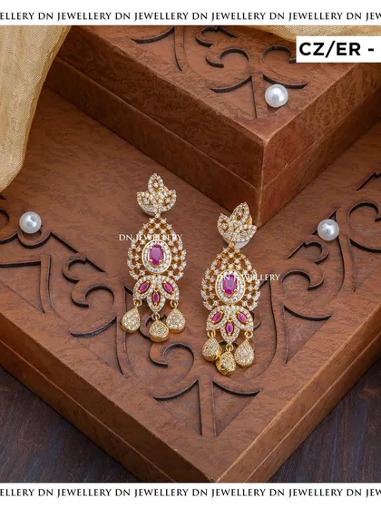 These gold-plated CZ and ruby earrings are a classic choice. The intricate design and vibrant colour make them perfect for a festive occasion.