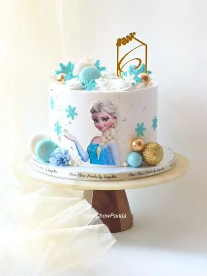 Another look at the elegant Elsa cake, perfect for a Frozen-themed party.