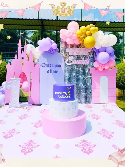 Once upon a time, a princess named Svidhi had a magical birthday. This outdoor castle theme featured a pink princess castle, a sequin backdrop, and a beautiful arrangement of pastel balloons fit for royalty.