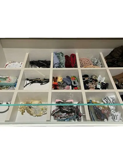An accessory drawer with custom dividers. This is a fantastic way to store hair clips, ties, and other small items so they are always visible and untangled.