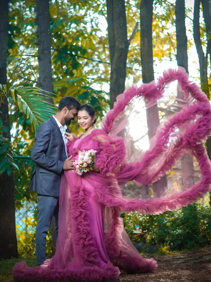 A truly magical forest setting. The way the light filters through the trees and the dramatic toss of the purple gown create a breathtaking, fairytale image.