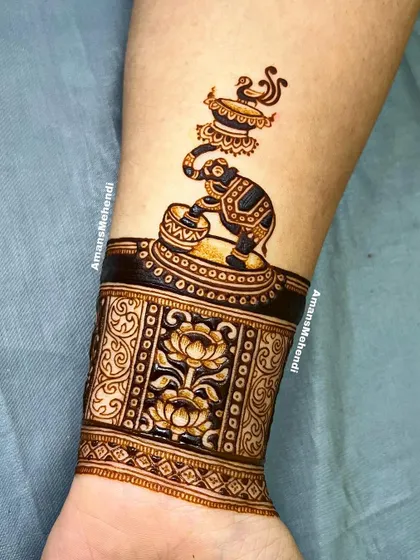 A unique wristband design featuring a ceremonial elephant, paired with a cuff of lotus flowers, showcasing my fine-line figurative work.