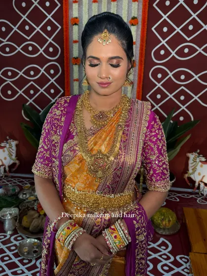 Another shot from the housewarming, set against a traditional backdrop, showing the complete look.