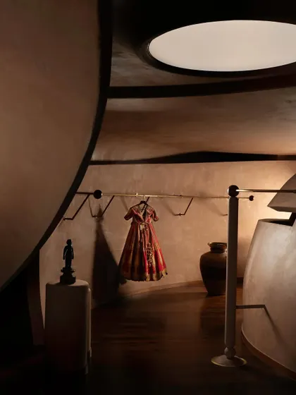 Additional perspectives of the House of Masaba flagship, detailing the interplay of sculptural forms, traditional furniture, and the brand's iconic fashion pieces within the warm, tactile environment.