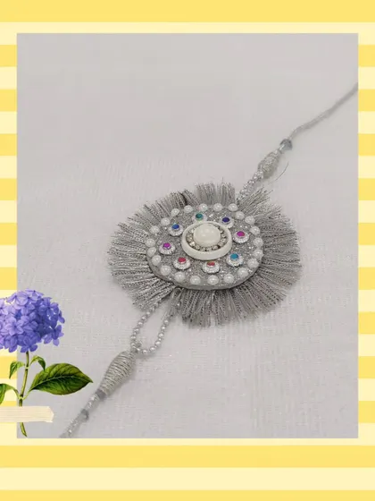 A beautiful handmade rakhi with intricate thread work and embellishments. Join our seasonal workshops to create your own for Raksha Bandhan.