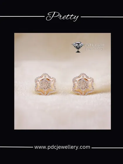 A pretty and unique pair of 18kt hallmarked gold and diamond earrings. The hexagonal shape with a star-like pattern inside is a modern and stylish choice.