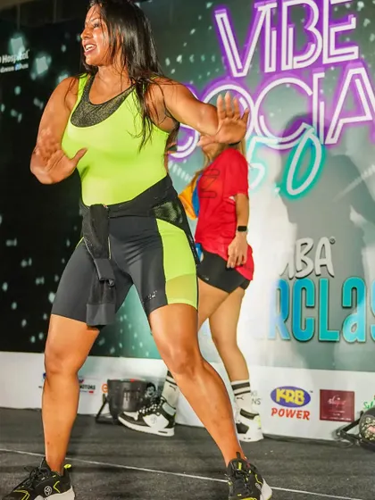 On stage, I bring my full energy to every performance. This shot from a high-energy Zumba fitness event in Ahmedabad captures the passion and power I pour into every class I lead.