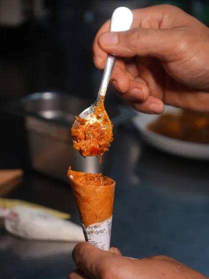A look at the process of filling our cornetts. Each one is generously filled by hand, ensuring every bite is as flavourful as the last.