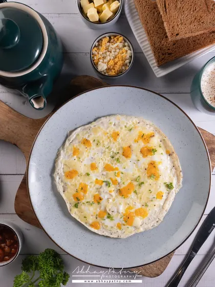 A top-down flat lay of an egg-white omelette. This angle is great for showing all the components of a breakfast platter in a clean and organized way.