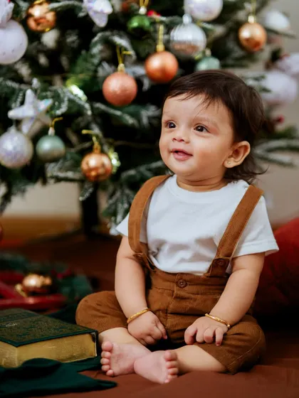 This little boy's happy expression says it all. Our Christmas sets are designed to be engaging and fun for children, allowing us to capture their genuine excitement.