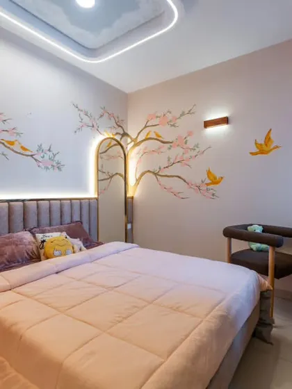 This bedroom in the Sakura project feels like spring all year round. The cherry blossom mural wraps around the room, with delicate birds in flight. The soft ceiling glow and curved mirror add to the dreamlike quality of the space.