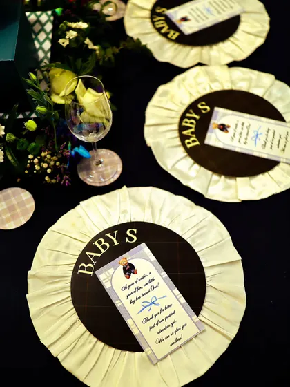 Custom-made rosettes served as unique place cards and party favors. This detail, inspired by equestrian awards, was a perfect nod to the 'Polo Club' theme and a delightful keepsake for guests.