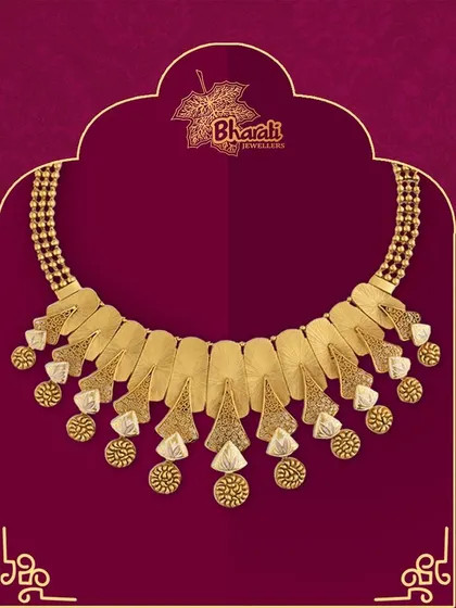 Elevate your style with this lightweight and flexible antique necklace. Featuring a stunning touch of Meenakari on modern, fan-like gold plates, it is designed to fit every neck effortlessly.