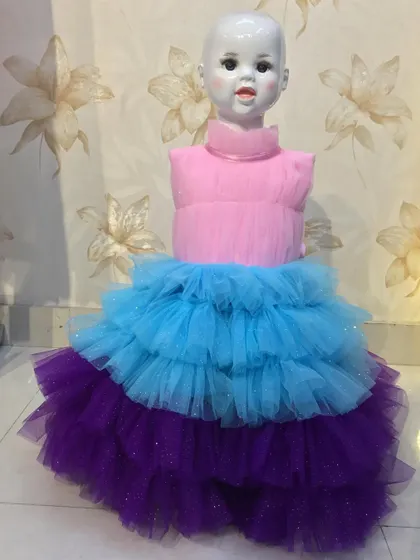 A fun, multi-colored frock with tiers of pink, blue, and purple tulle.