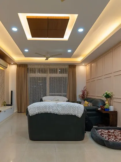 This living room design includes a comfortable dog bed, showing our commitment to designing for every member of the family, including furry ones.