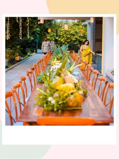 A long shot of the farm-to-table dinner setup, showing how the decor creates a stunning visual down the length of the table.