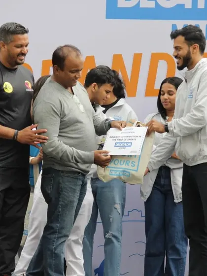 Our team helping distribute awards at a community sports event. It's a collective effort to make these gatherings successful and memorable for everyone involved.