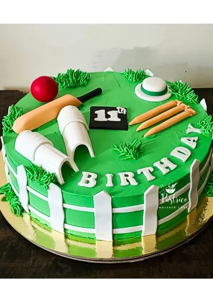A cricket-themed cake for an 11th birthday, with a green pitch and all the essential cricket gear made from fondant.