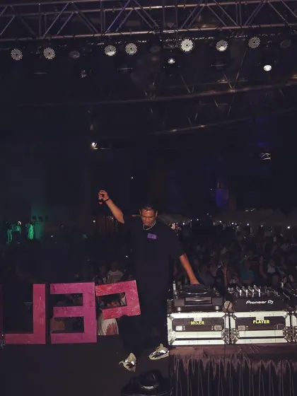 On stage at a music festival, in front of a massive crowd. I have the experience to handle large scale events and deliver a mainstage worthy performance.