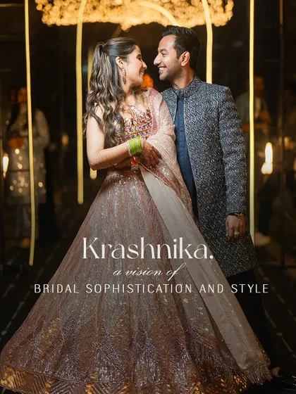 A vision of bridal sophistication and style. This portrait of the bride in her shimmering peach lehenga, with the groom by her side, captures the essence of their glamorous Sangeet look.
