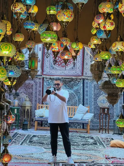 In a room full of Turkish lamps, a location that provides incredible light and color for portraits.