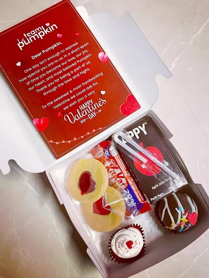We helped Team Pumpkin celebrate Valentine's Day at work with these fun mini hampers. Each box included a personalized card and a mix of sweet treats to make their team feel special.
