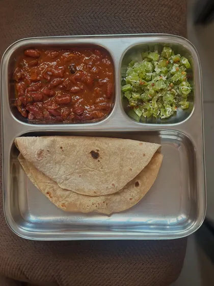 A simple, home-style meal of chapati with rajma curry and a side of sautéed bitter gourd, showcasing how everyday Indian food can be healthy.